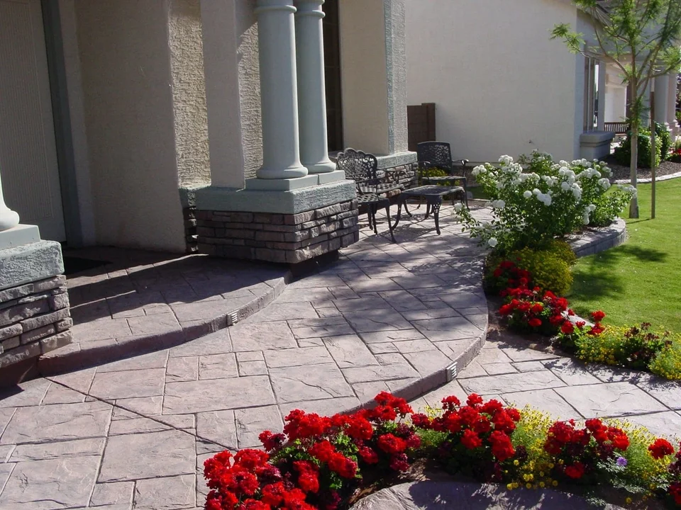 A planted border frames the approach to the house.