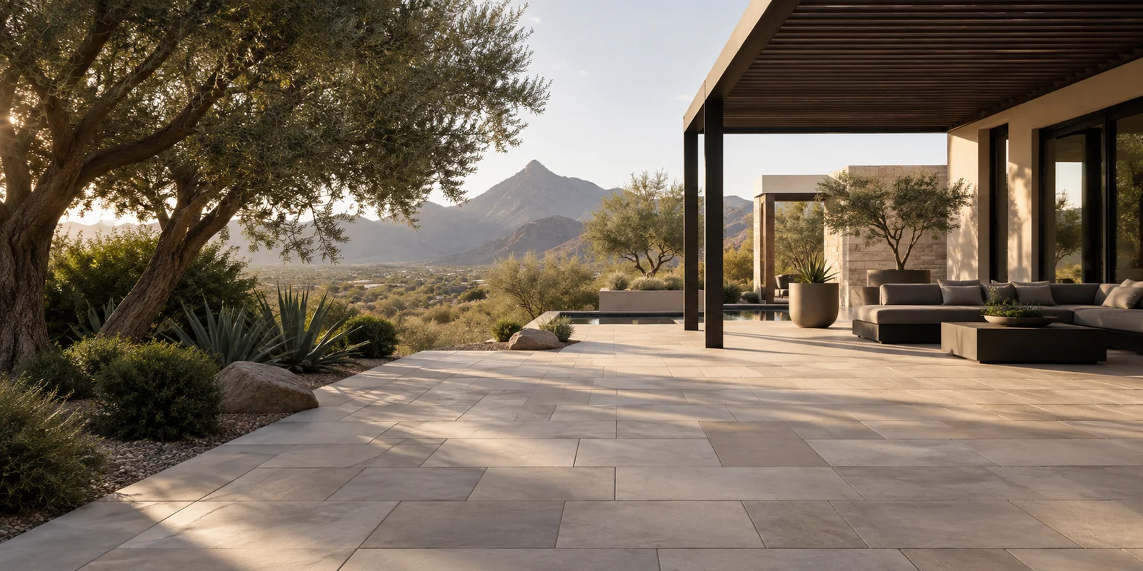 Warm stone-toned paver patio beside desert architecture. Design illustration.